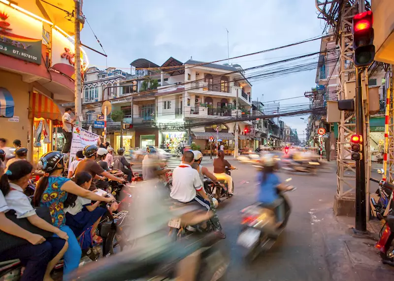 Zip around Ho Chi Minh City on a Vespa at night